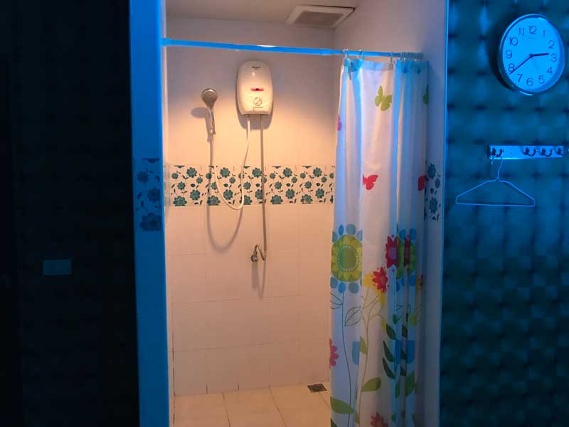 Shower stall inside massage room at Boss Massage Bangkok