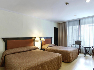 Standard guest room at Grace Hotel Bangkok