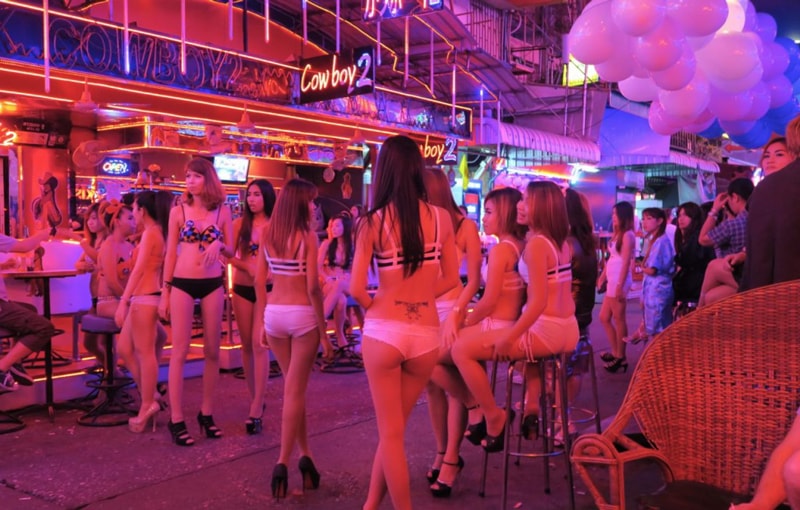 Bar girls standing outside in Soi Cowboy